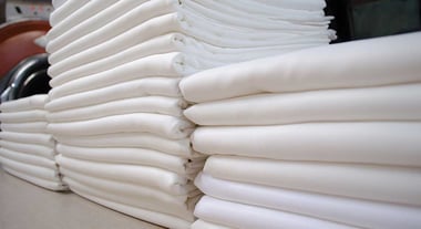 folded_white_laundry_pile